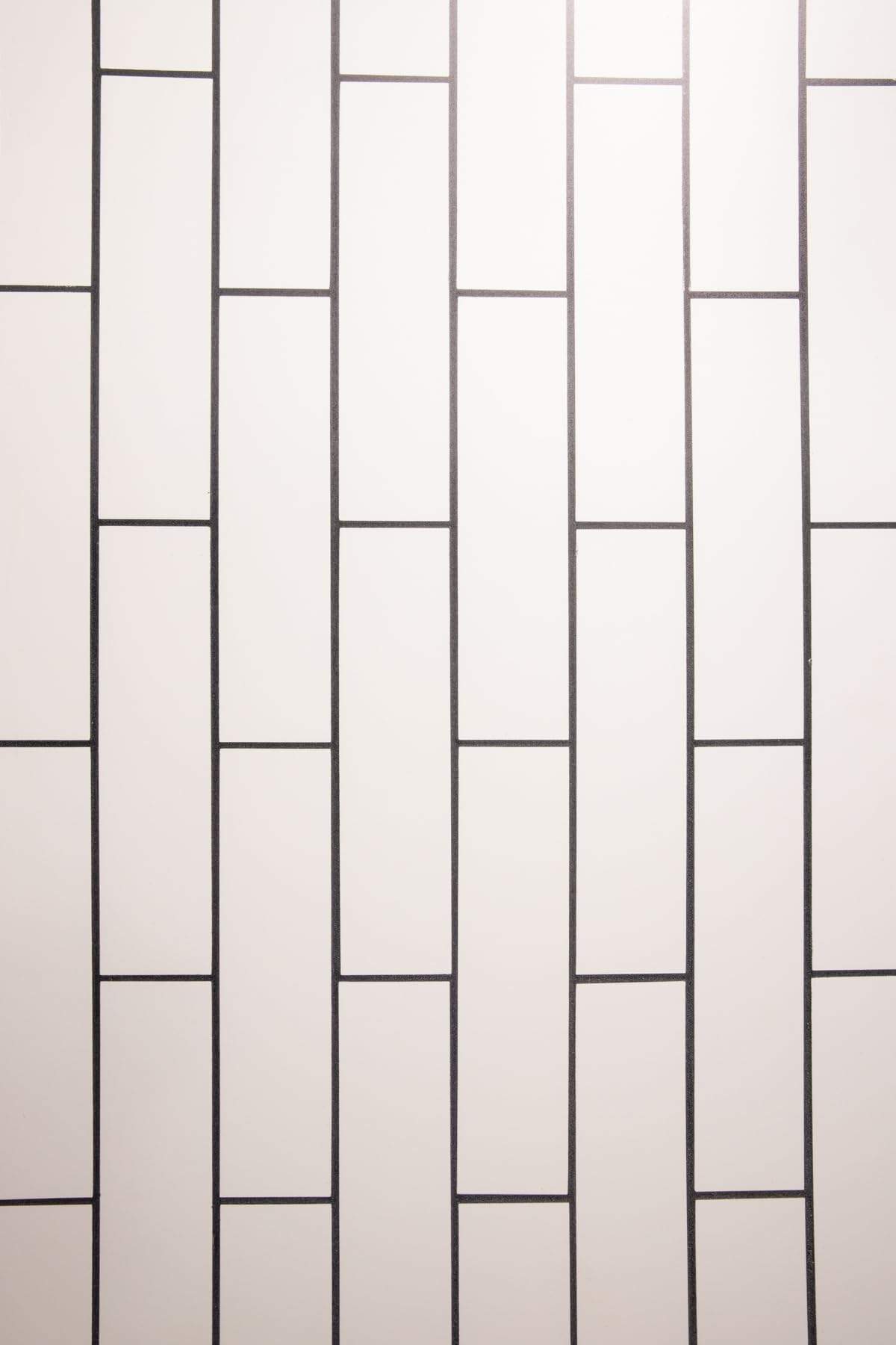 Add a sleek, modern look to your photography with the White Subway Tile with Black Grout Backdrop from Bessie Bakes Backdrops. This photography backdrop captures the clean, minimal aesthetic of classic subway tiles, enhanced with a bold contrast of black grout. Ideal for food styling, product photography, or lifestyle imagery, the smooth surface and simple design offer a crisp background that ensures your subject stands out beautifully.

The backdrop measures 2 ft x 3 ft and comes in a Lightweight Physical material that’s semi-rigid and ⅛-inch thick, making it durable and easy to use in flat-lay or standing setups. Whether you're creating content for social media or building a professional portfolio, this versatile backdrop will elevate your compositions with a refined, contemporary edge.